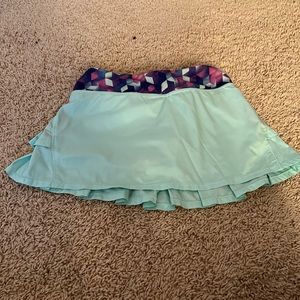 ivivva skirt, built in shorts, drawstring in waistband, back pocket.